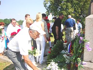 Flowers laying at the memorial on Lucavsala Island