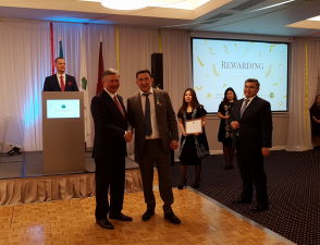 The Ambassador of Kazakhstan awards a medal to Adilbek Zhanabayev